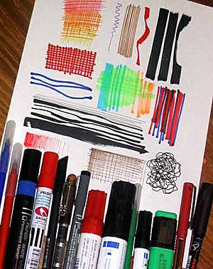 Fotografía de rotuladores con distintos grosores y sus trazos sobre papel